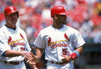 ST. LOUIS - JUNE 17:  Albert Pujols #5 of the St. Louis Cardinals is congratulated by teammate Mark McGwire #25 during the game against the Chicago White Sox at Busch Stadium on June 17, 2001 in St. Louis, Missouri. The Cardinals defeated the White Sox 8-3. (Photo by: Elsa/Getty Images)