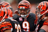 CINCINNATI - OCTOBER 25:  Carson Palmer #9 of the Cincinnati Bengals celebrates after thowing a touchdown pass during the NFL game against the Chicago Bears at Paul Brown Stadium on October 25, 2009 in Cincinnati, Ohio.  The Bengals won 45-10.  (Photo by Andy Lyons/Getty Images)