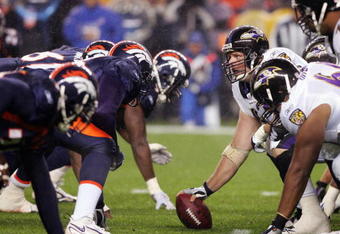 DENVER - OCTOBER 9:  Mike Flynn #62 of the Baltimore Ravens gets ready to hike the ball during the game against the Denver Broncos on October 9, 2006 at Invesco Field at Mile High in Denver, Colorado. (Photo by: Doug Pensinger/Getty Images)