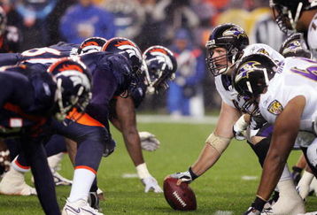 DENVER - OCTOBER 9:  Mike Flynn #62 of the Baltimore Ravens gets ready to hike the ball during the game against the Denver Broncos on October 9, 2006 at Invesco Field at Mile High in Denver, Colorado. (Photo by: Doug Pensinger/Getty Images)