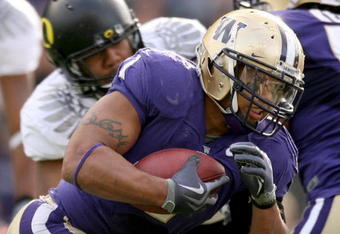 SEATTLE - OCTOBER 24:  Running back Chris Polk #1 of the Washington Huskies rushes against the Oregon Ducks on October 24, 2009 at Husky Stadium in Seattle, Washington. The Ducks defeated the Huskies 43-19. (Photo by Otto Greule Jr/Getty Images)
