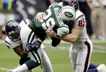 HOUSTON - SEPTEMBER 13: Leon Washington #29 of the New York Jets is tackled by Joel Dreesen #85 of the Houston Texans and Antwaun Molden #28 on a punt return at Reliant Stadium on September 13, 2009 in Houston, Texas.  (Photo by Bob Levey/Getty Images)