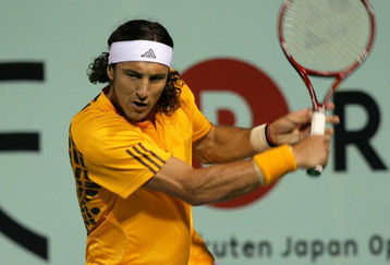 TOKYO - OCTOBER 08:  Juan Monaco of Argentina returns a shot in his match against Ernests Gulbis of Latvia during day four of the Rakuten Open Tennis tournament at Ariake Colosseum on October 8, 2009 in Tokyo, Japan.  (Photo by Kiyoshi Ota/Getty Images)