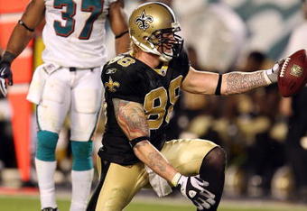 MIAMI - OCTOBER 25:  Tight end Jeremy Shockey #88 of the New Orleans Saints celebrates after making a first down reception over safety Yeremiah Bell #37 of the Miami Dolphins at Land Shark Stadium on October 25, 2009 in Miami, Florida. The Saints defeated the Dolphins 46-34.  (Photo by Doug Benc/Getty Images)