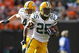 CLEVELAND, OH - OCTOBER 25: Ryan Grant #25 of the Green Bay Packers runs by Kenyon Coleman #90 of the Cleveland Browns at Cleveland Browns Stadium on October 25, 2009 in Cleveland, Ohio. (Photo by Matt Sullivan/Getty Images)