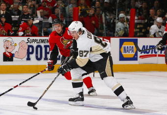 OTTAWA, CANADA - APRIL 16:  Sidney Crosby #87 of the Pittsburgh Penguins carries the puck over the blueline trailed by Dany Heatley #15 of the Ottawa Senators during game four of the 2008 Eastern Conference Quarter-Finals on April 16, 2008 at the Scotiabank Place in Ottawa, Canada.  (Photo by Phillip MacCallum/Getty Images)