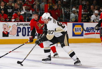 OTTAWA, CANADA - APRIL 16:  Sidney Crosby #87 of the Pittsburgh Penguins carries the puck over the blueline trailed by Dany Heatley #15 of the Ottawa Senators during game four of the 2008 Eastern Conference Quarter-Finals on April 16, 2008 at the Scotiabank Place in Ottawa, Canada.  (Photo by Phillip MacCallum/Getty Images)