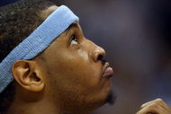 DENVER - MAY 29: Carmelo Anthony #15 of the Denver Nuggets looks on from the bench in the fourth quarter of Game Six of the Western Conference Finals during the 2009 NBA Playoffs against the Los Angeles Lakers at Pepsi Center on May 29, 2009 in Denver, Colorado. NOTE TO USER: User expressly acknowledges and agrees that, by downloading and or using this photograph, User is consenting to the terms and conditions of the Getty Images License Agreement. (Photo by Jed Jacobsohn/Getty Images)