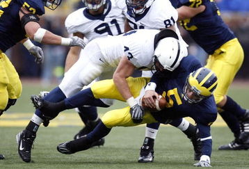 ANN ARBOR, MI - OCTOBER 24:  Tate Forcier #5 of the Michigan Wolverines gets taken down for a sack by Josh Hull #43 of the Penn State Nittany Lions on October 24, 2009 at Michigan Stadium in Ann Arbor, Michigan.  (Photo by Gregory Shamus/Getty Images)