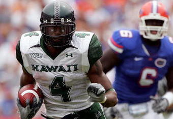 GAINESVILLE, FL - AUGUST 30:  Running back Leon Wright-Jackson #4 of the Hawaii Warriors runs for yardage during his game against the Florida Gators at Ben Hill Griffin Stadium on August 30, 2008 in Gainesville, Florida.  (Photo by Sam Greenwood/Getty Images)