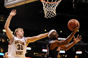 LOS ANGELES, CA - MARCH 12:  Guard Nic Wise #13 of the Arizona Wildcats takes a shot as  Rihards Kuksiks #30 of the Arizona State Sun Devils defends during the Pacific Life Pac-10 Men's Basketball Tournament at the Staples Center on March 12, 2009 in Los Angeles, California.  (Photo by Harry How/Getty Images)