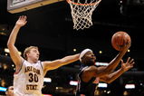 LOS ANGELES, CA - MARCH 12:  Guard Nic Wise #13 of the Arizona Wildcats takes a shot as  Rihards Kuksiks #30 of the Arizona State Sun Devils defends during the Pacific Life Pac-10 Men's Basketball Tournament at the Staples Center on March 12, 2009 in Los Angeles, California.  (Photo by Harry How/Getty Images)