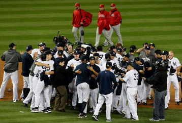 NEW YORK - OCTOBER 25:  The New York Yankees celebrate their 5-2 victory over the Los Angeles Angels of Anaheim at the end of the top of the ninth inning in Game Six of the ALCS during the 2009 MLB Playoffs at Yankee Stadium on October 25, 2009 in the Bronx borough of New York City. The New York Yankees won the ALCS series 4-2 over the Los Angeles Angels of Anaheim to capture the American League pennant.  (Photo by Jim McIsaac/Getty Images)