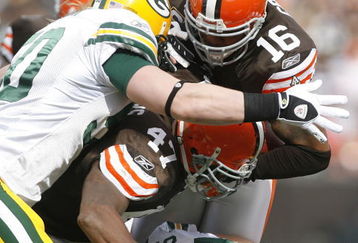 CLEVELAND, OH - OCTOBER 25:  Joshua Cribbs #16 of the Cleveland Browns is hit by A.J. Hawk #50 and Clay Matthews #52 of the Green Bay Packers at Cleveland Browns at Cleveland Browns Stadium on October 25, 2009 in Cleveland, Ohio.  (Photo by Matt Sullivan/Getty Images)
