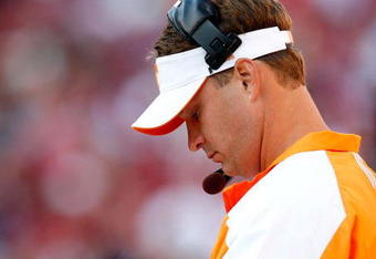 TUSCALOOSA, AL - OCTOBER 24:  Head coach Lane Kiffin of the Tennessee Volunteers looks at his play book against the Alabama Crimson Tide at Bryant-Denny Stadium on October 24, 2009 in Tuscaloosa, Alabama.  (Photo by Kevin C. Cox/Getty Images)
