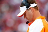 TUSCALOOSA, AL - OCTOBER 24:  Head coach Lane Kiffin of the Tennessee Volunteers looks at his play book against the Alabama Crimson Tide at Bryant-Denny Stadium on October 24, 2009 in Tuscaloosa, Alabama.  (Photo by Kevin C. Cox/Getty Images)