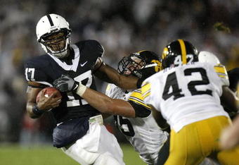 STATE COLLEGE, PA - SEPTEMBER 26:  Daryll Clark #17 of the Penn State Nittnay Lions is tackled by Karl Klug #95 and Jeremiha Hunter #42 of the Iowa Hawkeye's on September 26, 2009 at Beaver Stadium in State College, Pennsylvania.  (Photo by Gregory Shamus/Getty Images)