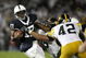 STATE COLLEGE, PA - SEPTEMBER 26:  Daryll Clark #17 of the Penn State Nittnay Lions is tackled by Karl Klug #95 and Jeremiha Hunter #42 of the Iowa Hawkeye's on September 26, 2009 at Beaver Stadium in State College, Pennsylvania.  (Photo by Gregory Shamus/Getty Images)