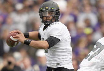 SEATTLE - OCTOBER 24: Quarterback Jeremiah Masoli #8 of the Oregon Ducks looks to pass the ball during the game against the Washington Huskies on October 24, 2009 at Husky Stadium in Seattle, Washington. The Ducks defeated the Huskies 43-19. (Photo by Otto Greule Jr/Getty Images)