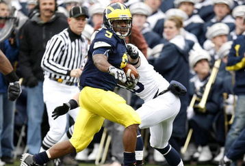 ANN ARBOR, MI - OCTOBER 24: Martavious Odoms #9 of the Michigan Wolverines tries to get around the tackle of Nick Sukay #18 of the Penn State Nittany Lions on October 24, 2009 at Michigan Stadium in Ann Arbor, Michigan. Penn State won the game 35-10. (Photo by Gregory Shamus/Getty Images)