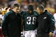 LANDOVER, MD - OCTOBER 26:  Brian Westbrook #36 of the Philadelphia Eagles is escorted off the field after getting hit during the first quarter of the game against the Washington Redskins at FedEx Field October 26, 2009 in Landover, Maryland. (Photo by Win McNamee/Getty Images)