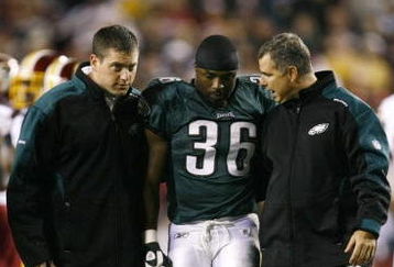LANDOVER, MD - OCTOBER 26:  Brian Westbrook #36 of the Philadelphia Eagles is escorted off the field after getting hit during the first quarter of the game against the Washington Redskins at FedEx Field October 26, 2009 in Landover, Maryland. (Photo by Win McNamee/Getty Images)