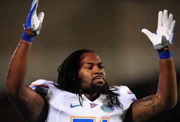 STARKVILLE, MS - OCTOBER 24:  Linebacker Brandon Spikes # 51 of the Florida Gators signals a touchdown against the Mississippi Bulldogs, at Davis Wade Stadium on  October 24, 2009 in Starkville, Mississippi  (Photo by Rick Dole/Getty Images)