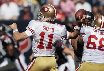 HOUSTON - OCTOBER 25:  Quarterback Alex Smith #11 of the San Francisco 49ers throws downfield at Reliant Stadium on October 25, 2009 in Houston, Texas.  (Photo by Bob Levey/Getty Images)