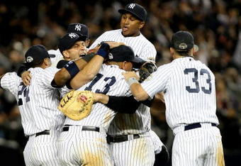 NEW YORK - OCTOBER 25:  The New York Yankees celebrate their 5-2 victory over the Los Angeles Angels of Anaheim at the end of the top of the ninth inning in Game Six of the ALCS during the 2009 MLB Playoffs at Yankee Stadium on October 25, 2009 in the Bronx borough of New York City. The New York Yankees won the ALCS series 4-2 over the Los Angeles Angels of Anaheim.  (Photo by Nick Laham/Getty Images)