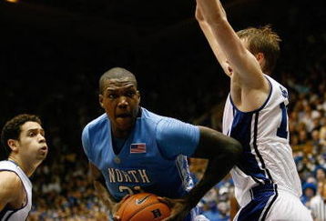 DURHAM, NC - FEBRUARY 11:  Deon Thompson #21 of the North Carolina Tar Heels moves to the basket against Kyle Singler #12 of the Duke Blue Devils during the game on February 11, 2009 at Cameron Indoor Stadium in Durham, North Carolina.  (Photo by Kevin C. Cox/Getty Images)