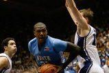 DURHAM, NC - FEBRUARY 11:  Deon Thompson #21 of the North Carolina Tar Heels moves to the basket against Kyle Singler #12 of the Duke Blue Devils during the game on February 11, 2009 at Cameron Indoor Stadium in Durham, North Carolina.  (Photo by Kevin C. Cox/Getty Images)