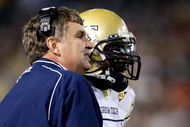 ATLANTA - OCTOBER 17:  Head coach Paul Johnson (L) of the Georgia Tech Yellow Jackets converses with quarterback Josh Nesbitt #9 after his touchdown against the Virginia Tech Hokies at Bobby Dodd Stadium on October 17, 2009 in Atlanta, Georgia.  (Photo by Kevin C. Cox/Getty Images)
