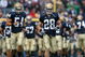 SOUTH BEND, IN - OCTOBER 03: Kyle McCarthy #28 and Anthony McDonald #54 of the Notre Dame Fighting Irish run onto the field with teammates before a game against the Washington Huskies on October 3, 2009 at Notre Dame Stadium in South Bend, Indiana. Notre Dame defeated Washington 37-30 in overtime. (Photo by Jonathan Daniel/Getty Images)