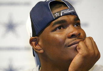 IRVING, TX - MARCH 22:  Keyshawn Johnson listens to Dallas Cowboys owner Jerry Jones during a media conference to announce his signing by the Cowboys on March 22, 2004 at Valley Ranch in Irving, Texas.  (Photo by Chris Hamilton/Getty Images)