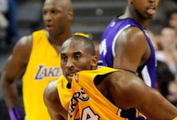 LAS VEGAS - OCTOBER 15:  Kobe Bryant #24 of the Los Angeles Lakers chews on his jersey as he plays defense against the Sacramento Kings during their preseason game at the Thomas & Mack Center October 15, 2009 in Las Vegas, Nevada. NOTE TO USER: User expressly acknowledges and agrees that, by downloading and/or using this Photograph, user is consenting to the terms and conditions of the Getty Images License Agreement.  (Photo by Ethan Miller/Getty Images)