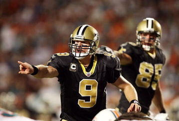 MIAMI - OCTOBER 25:  Quarterback Drew Brees #9 of the New Orleans Saints directs his offense pre-snap against the Miami Dolphins at Land Shark Stadium on October 25, 2009 in Miami, Florida. The Saints defeated the Dolphins 46-34.  (Photo by Doug Benc/Getty Images)