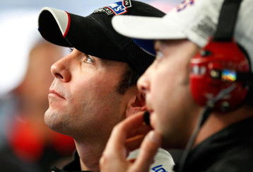 CONCORD, NC - OCTOBER 16: Jimmie Johnson (L), driver of the #48 Lowe's Chevrolet, watches lap times with crew chief Chad Knaus (R) during practice for the NASCAR Sprint Cup Series NASCAR Banking 500 at Lowe's Motor Speedway on October 16, 2009 in Concord, North Carolina.  (Photo by Geoff Burke/Getty Images for NASCAR)