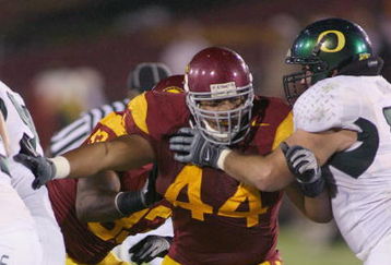 LOS ANGELES - OCTOBER 4:  Christian Tupou of the USC Trojans rushes against the Oregon Ducks on October 4, 2008 at the Los Angeles Memorial Coliseum in Los Angeles, California.  USC won 44-10.  (Photo by Jeff Golden/Getty Images)