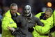 6 Nov 1999: Halloween intruder is led away by stewards during the FA Carling Premiership match between Sheffield Wednesday and Watford at Hillsborough in Sheffield, England. \ Mandatory Credit: Mark Thompson /Allsport