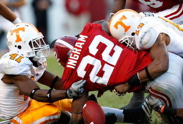 TUSCALOOSA, AL - OCTOBER 24:  Dennis Rogan #41 and Eric Berry #14 of the Tennessee Volunteers force a fumble by Mark Ingram #22 of the Alabama Crimson Tide at Bryant-Denny Stadium on October 24, 2009 in Tuscaloosa, Alabama.  (Photo by Kevin C. Cox/Getty Images)