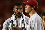 MIAMI GARDENS, FL - OCTOBER 03:  Injured players, tight end Jermaine Gresham #18, L, and quarterback Sam Bradford #14 of the Oklahoma Sooners, talk on the sideline late in the game against the Miami Hurricanes at Land Shark Stadium on October 3, 2009 in Miami Gardens, Florida. Miami defeated Oklahoma 21-20.  (Photo by Doug Benc/Getty Images)
