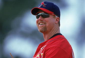 12 Mar 2000: Mark McGwire #25 of the St. Louis Cardinals smiles as he stands in the field during a Spring Training Game against the Los Angeles Dodgers at the Holman Stadium in Vero Beach, Florida. The Cardinals defeated the Dodgers 7-5. Mandatory Credit: Harry How  /Allsport
