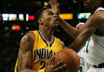 BOSTON - FEBRUARY 27:  Brandon Rush #25 of the Indiana Pacers heads for the net as Mikki Moore #7 of the Boston Celtics defends on February 27, 2009 at TD Banknorth Garden in Boston, Massachusetts.The Celtics defeated the Pacers 104-99. NOTE TO USER: User expressly acknowledges and agrees that, by downloading and or using this Photograph, user is consenting to the terms and conditions of the Getty Images License Agreement.  (Photo by Elsa/Getty Images)