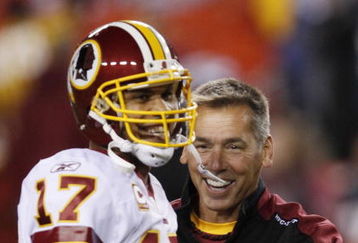 LANDOVER, MD - OCTOBER 26:  Head coach Jim Zorn of the Washington Redskins jokes around with quarterback Jason Campbell #17 during warm ups before the game against the Philadelphia Eagles at FedEx Field October 26, 2009 in Landover, Maryland. (Photo by Win McNamee/Getty Images)