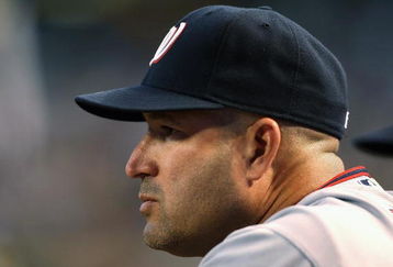 PHOENIX - MAY 08:  Manager Manny Acta #14 of the Washington Nationals looks on from the dugout during the game against the Arizona Diamondbacks at Chase Field on May 8, 2009 in Phoenix, Arizona.  (Photo by Christian Petersen/Getty Images)