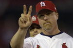 ST. LOUIS - OCTOBER 12:  Mark McGwire #25 of the St.Louis Cardinals salutes the crowd during team introductions before Game three of the National League Division Series against the Arizona Diamondbacks on October 12, 2001 at Busch Stadium in St. Louis, Missouri. The Diamondbacks won 5-3.  (Photo by Elsa/Getty Images)