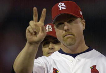 ST. LOUIS - OCTOBER 12:  Mark McGwire #25 of the St.Louis Cardinals salutes the crowd during team introductions before Game three of the National League Division Series against the Arizona Diamondbacks on October 12, 2001 at Busch Stadium in St. Louis, Missouri. The Diamondbacks won 5-3.  (Photo by Elsa/Getty Images)