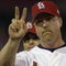 ST. LOUIS - OCTOBER 12:  Mark McGwire #25 of the St.Louis Cardinals salutes the crowd during team introductions before Game three of the National League Division Series against the Arizona Diamondbacks on October 12, 2001 at Busch Stadium in St. Louis, Missouri. The Diamondbacks won 5-3.  (Photo by Elsa/Getty Images)