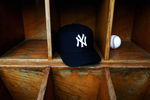 TAMPA, FL - FEBRUARY 25:  A New York Yankees cap and a baseball are seen at Legends Field on February 25, 2005 in Tampa, Florida. (Photo by Ezra Shaw/Getty Images)