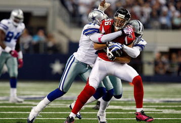 ARLINGTON, TX - OCTOBER 25:  Wide receiver Brian Finneran #86 of the Atlanta Falcons is tackled by Terence Newman #41 and Gerald Sensabaugh #43 of the Dallas Cowboys at Cowboys Stadium on October 25, 2009 in Arlington, Texas.  (Photo by Ronald Martinez/Getty Images)